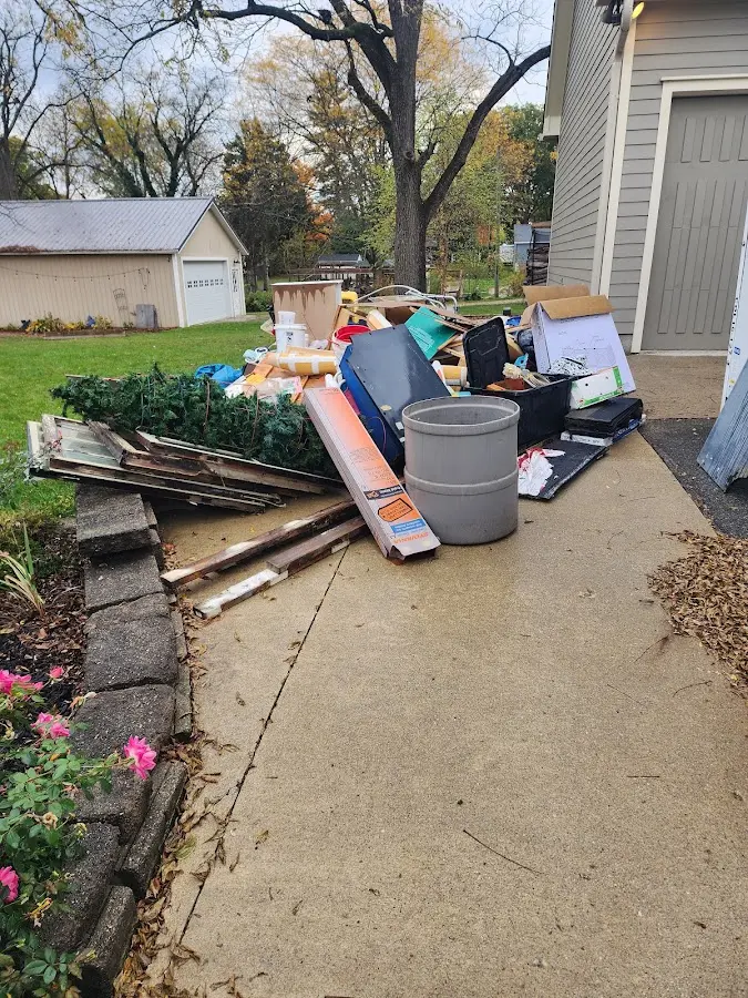 Dumpster being loaded with debris for Demolition Dumpster Rental in Brookshire